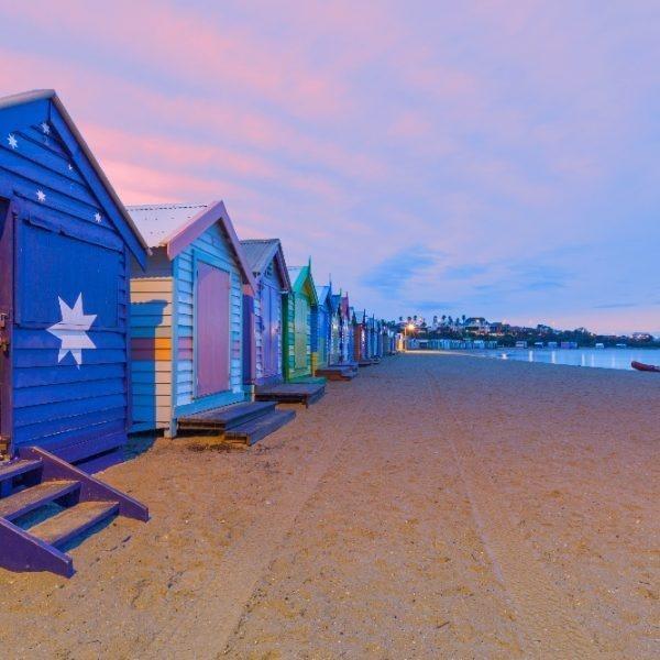 Beautiful Brighton bathing houses with rescue boat at sunrise, Melbourne, Australia