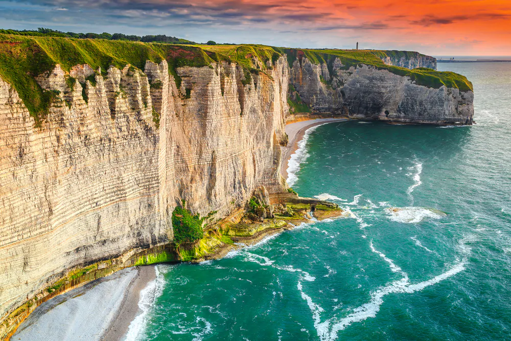 Amazing rocky coastline and magical sunset, Etretat, Normandy, France, Europe